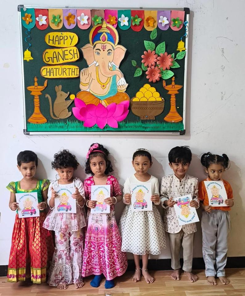 Children with Ganesh Chaturthi cards