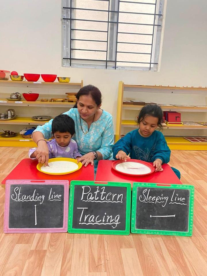 Educator guiding pattern tracing