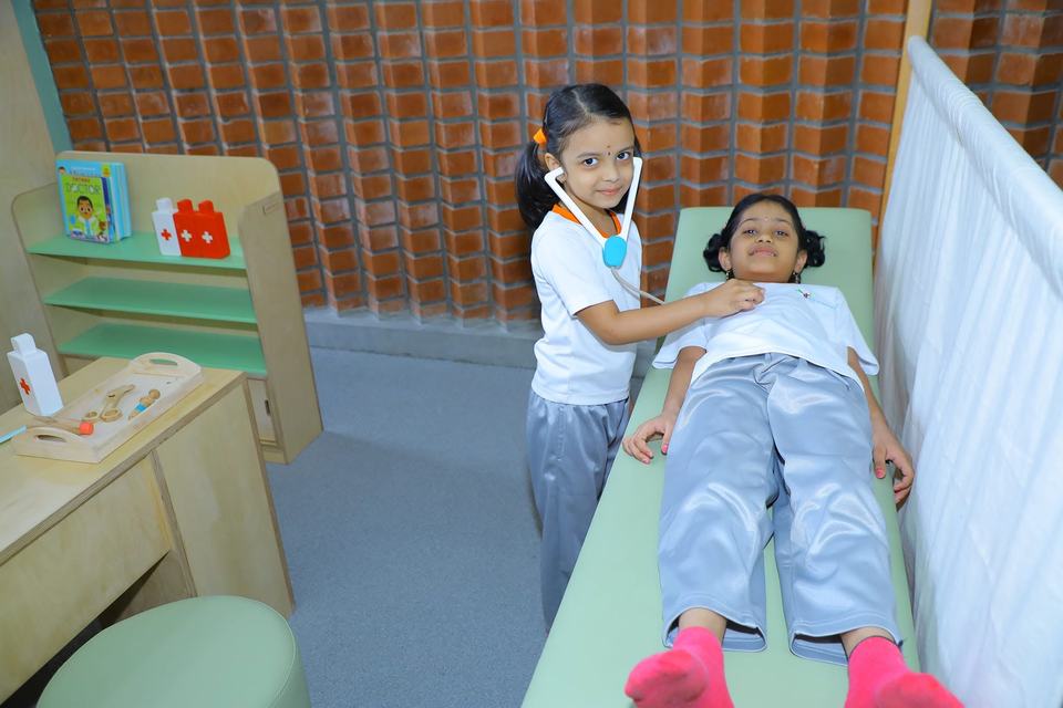 Children in pretend doctor role play