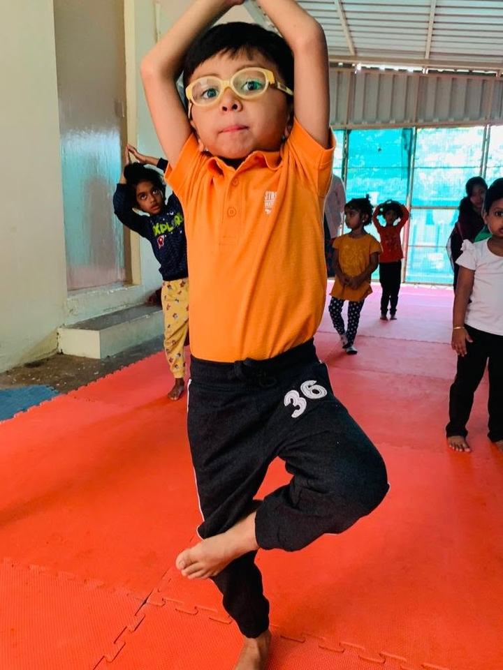 Child practicing tree pose